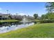 Community with pond and fountain features and lush landscaping at 4148 Gauge Line Loop, Tampa, FL 33624