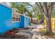 Blue house exterior with a patio and a jacuzzi in the backyard at 4411 3Rd S Ave, St Petersburg, FL 33711