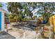 Spacious backyard featuring a jacuzzi, shed and is surrounded by a wooden fence at 4411 3Rd S Ave, St Petersburg, FL 33711
