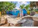 Exterior of the blue house with a shed and seating area in the backyard at 4411 3Rd S Ave, St Petersburg, FL 33711