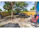Backyard featuring a jacuzzi and tall trees, surrounded by a wooden fence at 4411 3Rd S Ave, St Petersburg, FL 33711