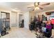 Unfinished basement with tile flooring, neutral walls, standard door closets, and packed with items at 4411 3Rd S Ave, St Petersburg, FL 33711