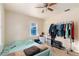 Bedroom with neutral walls, updated flooring, a standard single door closet, and wardrobe rack at 4411 3Rd S Ave, St Petersburg, FL 33711