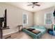 Bedroom with neutral walls, updated flooring, a standard single door closet, and large window at 4411 3Rd S Ave, St Petersburg, FL 33711