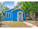 Cozy bungalow with a bright blue exterior, white trim, and a classic front door at 4411 3Rd S Ave, St Petersburg, FL 33711