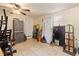 Tiled floor garage featuring household storage, cleaning, and maintenance tools, with ceiling fan and window at 4411 3Rd S Ave, St Petersburg, FL 33711