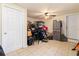 Cluttered garage featuring tiled floor, storage cabinet, and assorted household goods at 4411 3Rd S Ave, St Petersburg, FL 33711