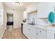 Updated kitchen with white cabinets, subway tile backsplash, and stainless steel appliances at 4411 3Rd S Ave, St Petersburg, FL 33711