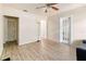 Neutral living room featuring wood-look floors, white trim, and abundant natural light at 4411 3Rd S Ave, St Petersburg, FL 33711