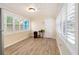 Bright sunroom with wood-look flooring, white paneled ceiling, and an abundance of natural light at 4411 3Rd S Ave, St Petersburg, FL 33711