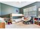 bedroom featuring bunk beds, window and chair at 5206 Cindy Kay Dr, Plant City, FL 33566