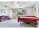 This cozy bedroom has a comfortable bed and views of the yard, providing a peaceful retreat for rest and relaxation at 5206 Cindy Kay Dr, Plant City, FL 33566
