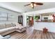 An open-concept living room flows into the dining area and kitchen, creating a welcoming and connected living space at 5206 Cindy Kay Dr, Plant City, FL 33566
