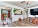 This bright living room connects seamlessly to the dining area and kitchen, ideal for modern living and entertaining at 5206 Cindy Kay Dr, Plant City, FL 33566