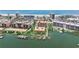 Beautiful beachside condo building with lush green space, boat docks and tennis courts at 5353 Gulf Blvd # A402, St Pete Beach, FL 33706