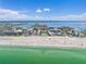 Aerial shot of condo on beach with ocean views and surrounding cityscape at 5353 Gulf Blvd # A402, St Pete Beach, FL 33706