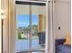 Relaxing balcony view overlooking the ocean with outdoor seating and beach views framed by white curtains at 5353 Gulf Blvd # A402, St Pete Beach, FL 33706