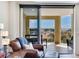 The exterior balcony has glass sliding door access from the living room and is furnished with outdoor furniture at 5353 Gulf Blvd # A402, St Pete Beach, FL 33706
