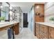 Well-lit modern bathroom featuring a dual sink vanity, frameless glass shower, and stylish wood accents at 5353 Gulf Blvd # A402, St Pete Beach, FL 33706