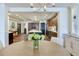 Dining room featuring hardwood floors, a modern kitchen, and ample natural light at 5353 Gulf Blvd # A402, St Pete Beach, FL 33706