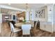 Open floor plan view of a dining area connecting to a modern kitchen space at 5353 Gulf Blvd # A402, St Pete Beach, FL 33706