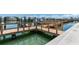 A new dock sits on calm water with multiple boat slips at 5353 Gulf Blvd # A402, St Pete Beach, FL 33706