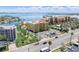 Condo complex surrounded by palm trees and manicured lawns, near the water at 5353 Gulf Blvd # A402, St Pete Beach, FL 33706