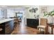 Open concept kitchen with island and adjacent seating area in modern condo at 5353 Gulf Blvd # A402, St Pete Beach, FL 33706