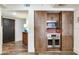 Kitchen nook with a built-in oven, microwave, and wooden sliding cabinet doors at 5353 Gulf Blvd # A402, St Pete Beach, FL 33706