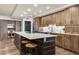 Stylish kitchen with wood cabinets, stainless steel appliances, and a center island with barstool seating at 5353 Gulf Blvd # A402, St Pete Beach, FL 33706