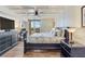 Bedroom featuring coffered ceilings, hardwood floors, and exterior views at 5353 Gulf Blvd # A402, St Pete Beach, FL 33706