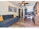 Cozy office space with hardwood floors, a comfortable sofa, built-in shelving, and ample natural light at 5353 Gulf Blvd # A402, St Pete Beach, FL 33706