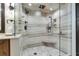 Modern glass enclosed walk-in shower featuring dual shower heads, built-in bench, and tiled surround at 5353 Gulf Blvd # A402, St Pete Beach, FL 33706