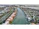A coastal neighborhood features waterfront homes and condos along a winding canal at 610 Pinellas Bayway S # 5202, Tierra Verde, FL 33715