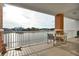 Balcony with outdoor seating and water views at 610 Pinellas Bayway S # 5202, Tierra Verde, FL 33715