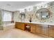 Bright bathroom features dual sinks, tub and separate glass shower at 610 Pinellas Bayway S # 5202, Tierra Verde, FL 33715