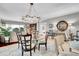 Elegant dining room featuring a glass table, stylish chairs, and decorative chandelier at 610 Pinellas Bayway S # 5202, Tierra Verde, FL 33715
