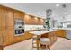 Spacious kitchen with modern appliances, custom cabinets, island with seating, and eat in breakfast nook at 610 Pinellas Bayway S # 5202, Tierra Verde, FL 33715