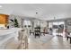 Inviting living area with a dining table, comfortable seating, and sliding doors to a balcony with water views at 610 Pinellas Bayway S # 5202, Tierra Verde, FL 33715