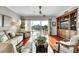 Bright living room with water views, comfortable seating, and custom built-ins at 610 Pinellas Bayway S # 5202, Tierra Verde, FL 33715