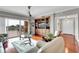Cozy living room with built-in shelving, balcony access, and comfortable seating at 610 Pinellas Bayway S # 5202, Tierra Verde, FL 33715