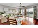 Inviting living room with plush seating, wood floors, and picturesque balcony view at 610 Pinellas Bayway S # 5202, Tierra Verde, FL 33715