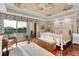 Main bedroom boasts tray ceiling, en-suite bath and water views at 610 Pinellas Bayway S # 5202, Tierra Verde, FL 33715