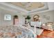 Charming main bedroom with decorative ceiling, hardwood floors, and lots of natural light at 610 Pinellas Bayway S # 5202, Tierra Verde, FL 33715