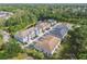 Aerial view of the neighborhood showcasing the community's layout, landscaping, and proximity to a pond at 6825 Citrus Creek Ln, Tampa, FL 33625