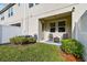 The backyard includes a patio with seating, green lawn, and privacy fence at 6825 Citrus Creek Ln, Tampa, FL 33625