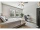 Comfortable bedroom with natural light, a ceiling fan, and neutral decor at 6825 Citrus Creek Ln, Tampa, FL 33625
