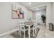 The light and airy dining room is perfect for entertaining with decorative wall art at 6825 Citrus Creek Ln, Tampa, FL 33625