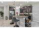 Kitchen island with granite countertops and seating is great for cooking and entertaining at 6825 Citrus Creek Ln, Tampa, FL 33625