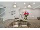 Open-concept kitchen with granite countertops and stainless steel sink is great for hosting at 6825 Citrus Creek Ln, Tampa, FL 33625